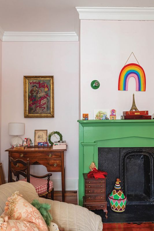 In Cricket’s room, a Benjamin Moore “Emerald Isle”-painted fireplace surround pops against the Farrow & Ball “Middleton Pink” walls.