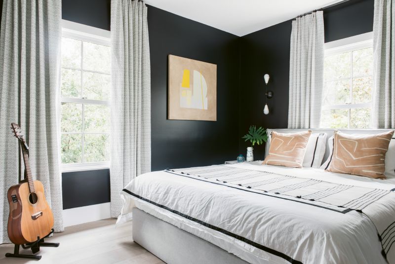 In the guest room, textiles—such as draperies by North Carolina-based Adelene and accent pillows by Kelly Wearstler—add subtle patterns and texture.