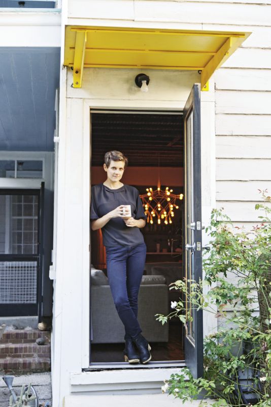 Johnny Tucker designed the back door’s modern yellow portico
