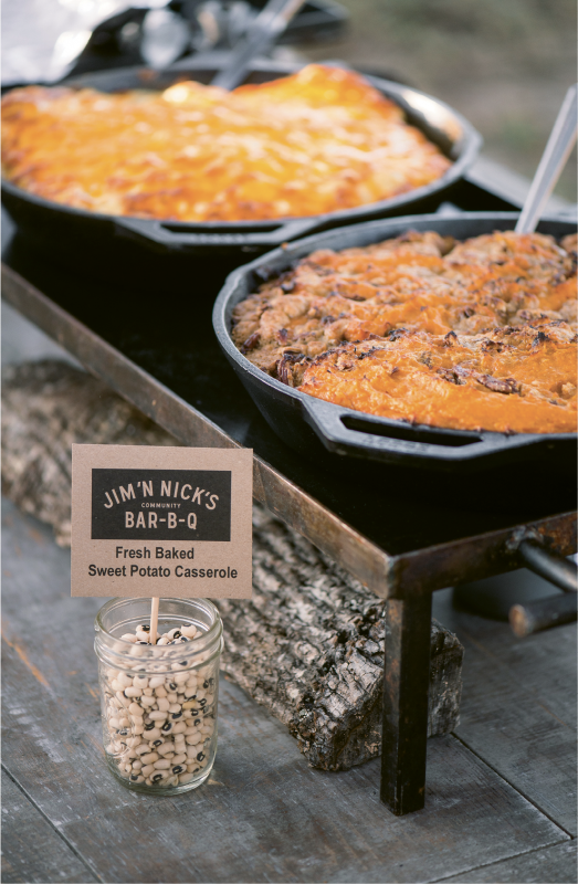 The cast-iron skillets and black-eyed pea menu markers on the buffet table fit right in with the event’s down-home vibe.