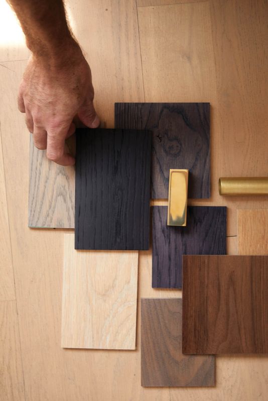 Various studio samples in oak, walnut, and brass