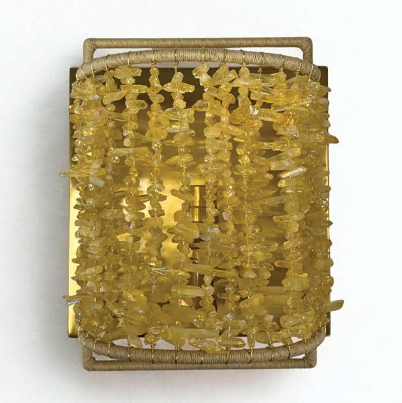 Lighting includes  wall sconces, from the sleek, glass “Thomas” to beaded styles, as well as intricately woven pendants