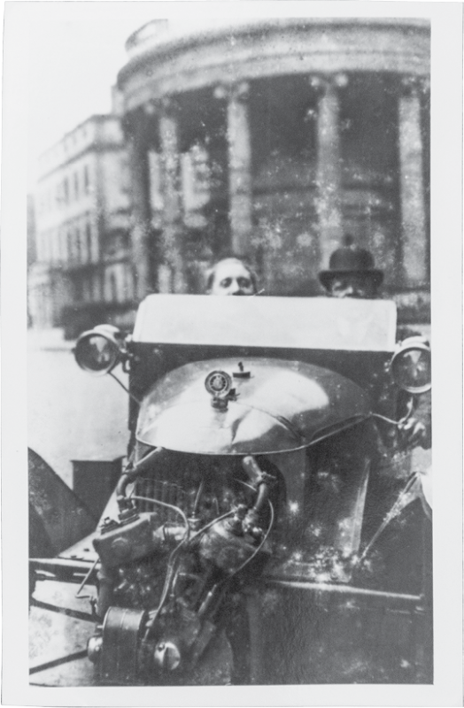 Edmund, driving with a friend (city and date unknown).
